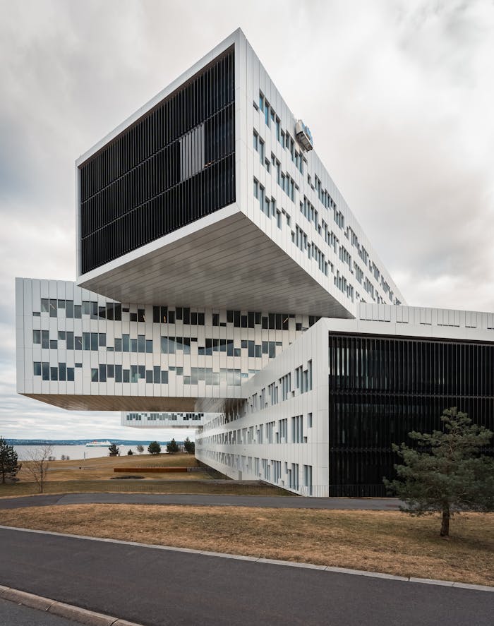 Strikingly designed modern office building with unique geometric structure outdoors.