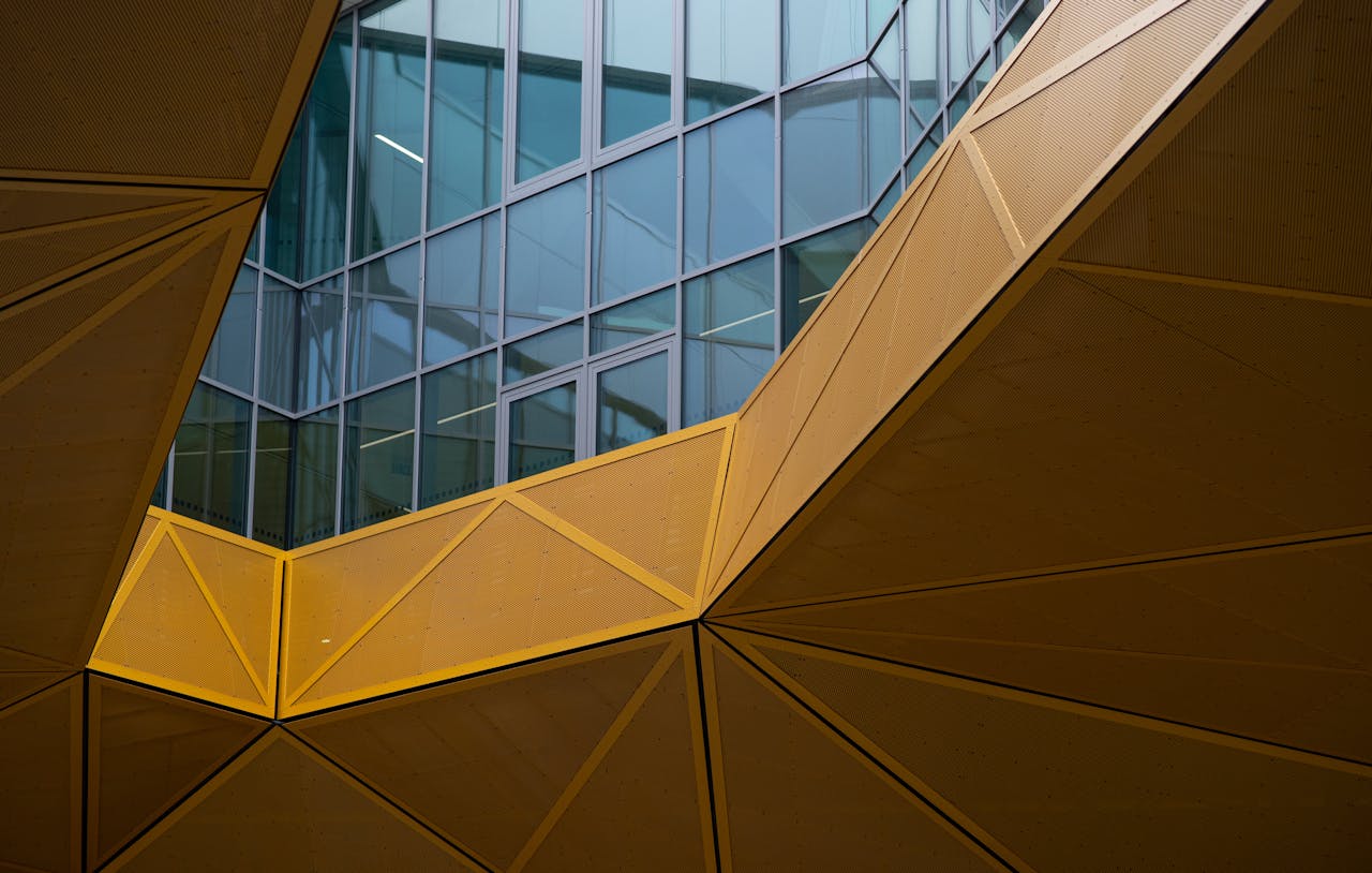Geometric modern architecture in Brno, showcasing striking yellow and glass design features.